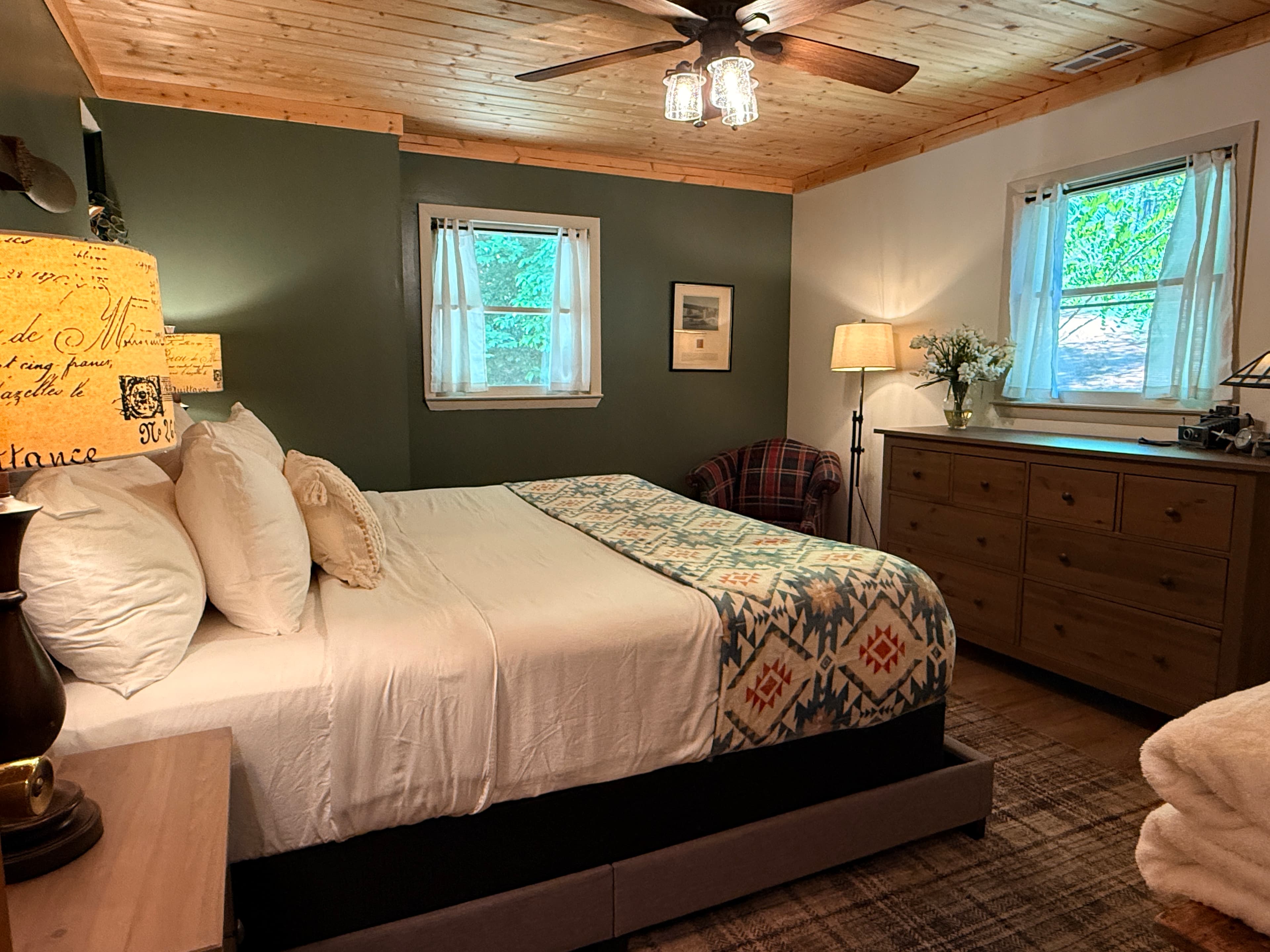 Guest bedroom with king size bed and themed to honor Amelia Earhart