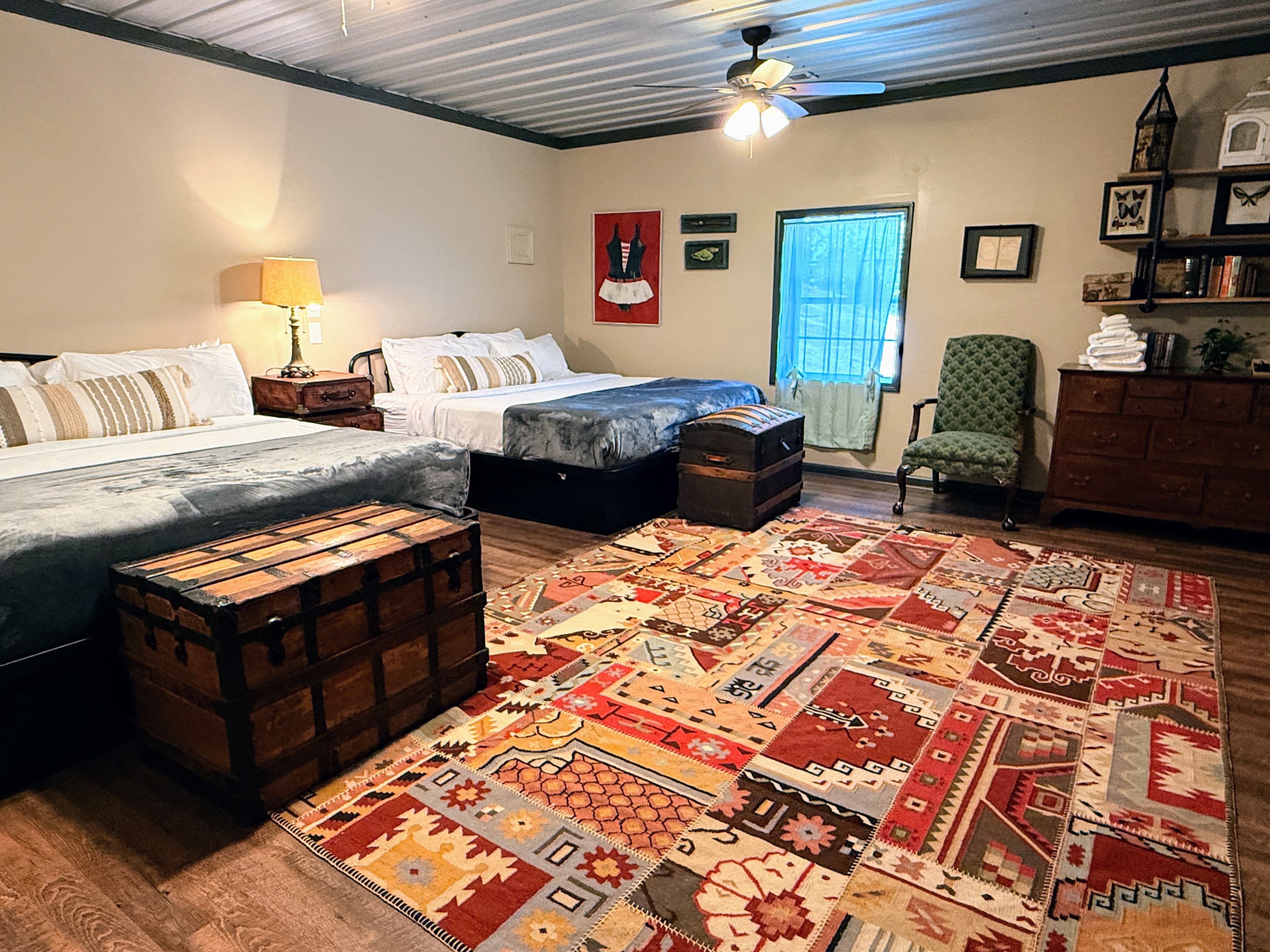 Large third bedroom in the Livingstone Great House featuring two king-sized beds, perfect for families or group retreats and honoring Alexander von Humbolt.