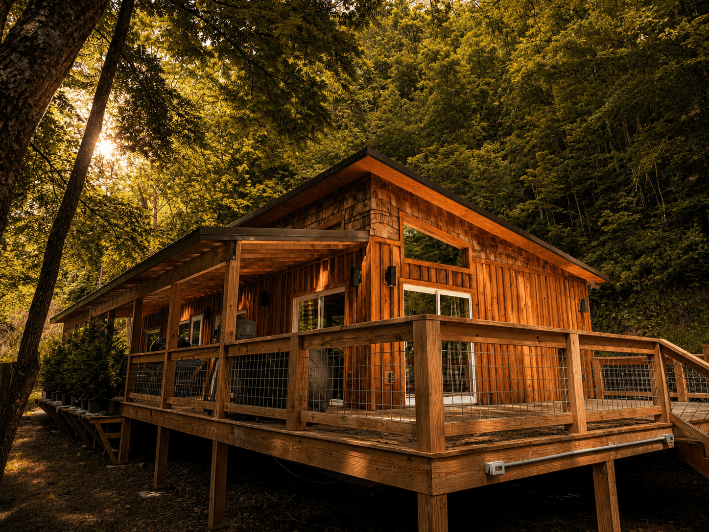 Exterior of the Crockett Creekside Retreat at Three Little Bears Retreat featuring a wraparound deck in Bryson City, North Carolina.