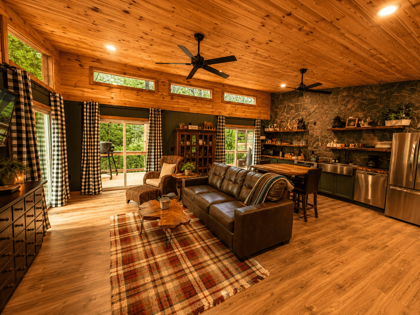 Open-concept great room and kitchen at Crockett Creekside Retreat with rustic lodge décor at Three Little Bears Retreat in Bryson City, North Carolina
