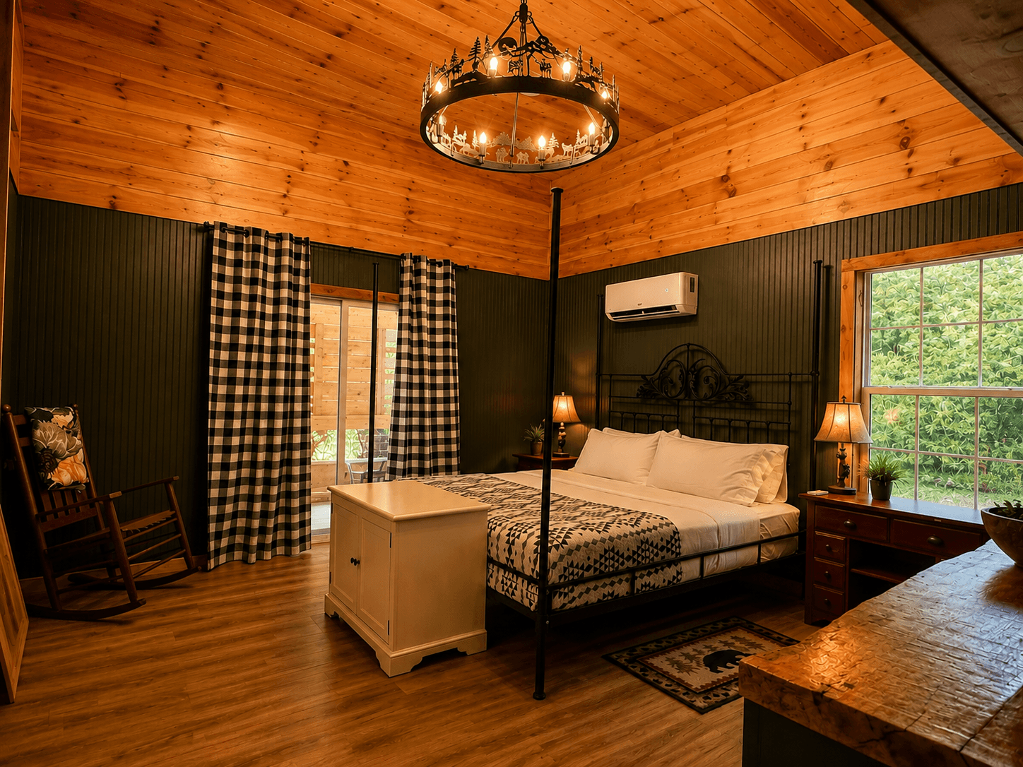 Spacious master bedroom at Crockett Creekside Retreat featuring vaulted wood ceilings at Three Little Bears Retreat in Bryson City, North Carolina.
