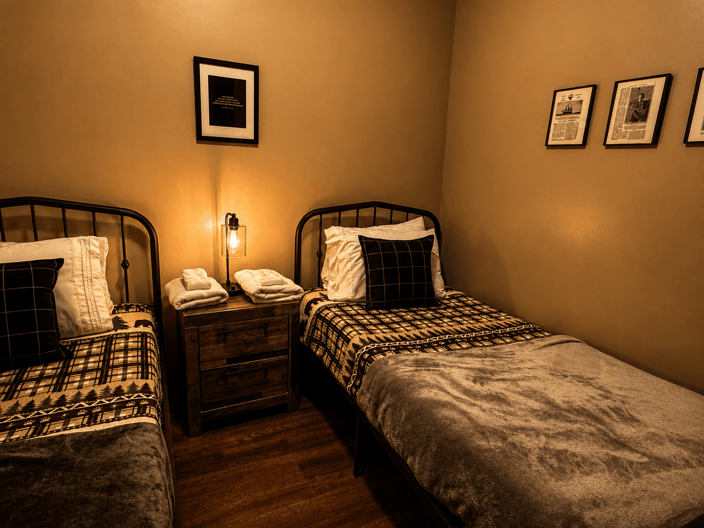 Family Suite: 2 of 3 rooms featuring Cozy twin bedroom at Livingstone Station Lodge with rustic mountain lodge décor in Bryson City, North Carolina.