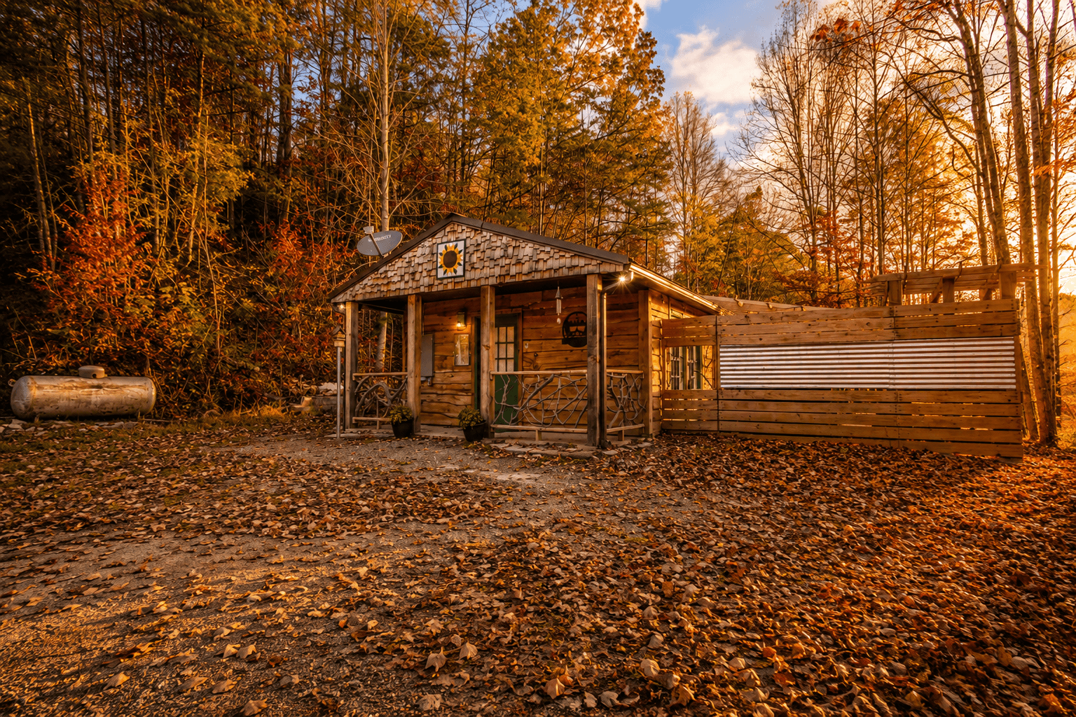 Front view of Sequoyah Retreat at Three Little Bears Retreat in Bryson City, North Carolina, surrounded by colorful autumn foliage in the Great Smoky Mountains.